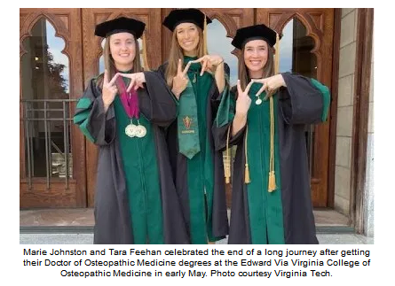Marie and Tara celebrate after getting their doctorate degrees