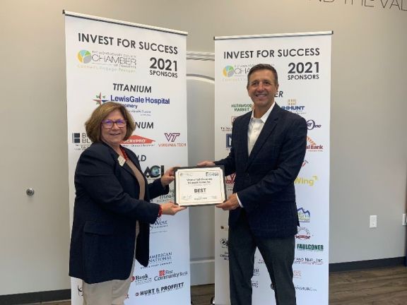 Two People Receiving Award